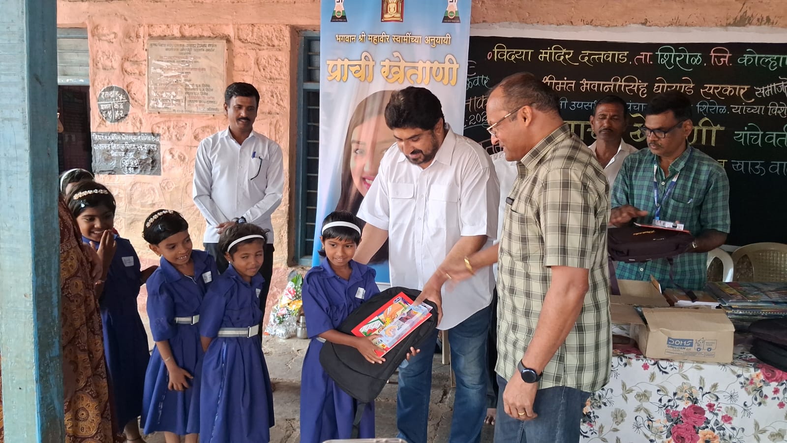 Distribution of educational materials to students on behalf of Prachi Khetani